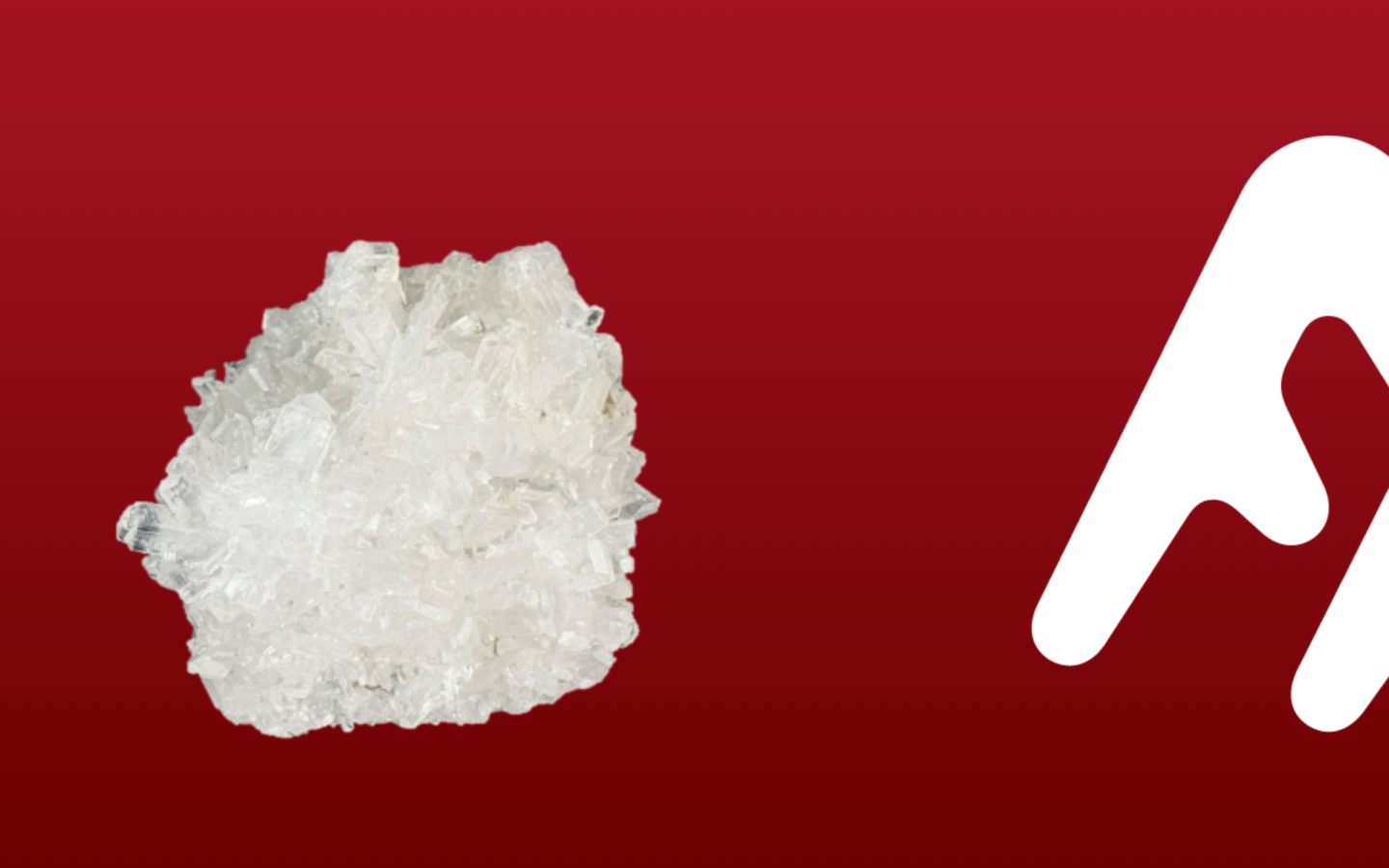 Cluster of clear, white crystalline mineral against a solid red background with a partial white geometric shape on the right side.